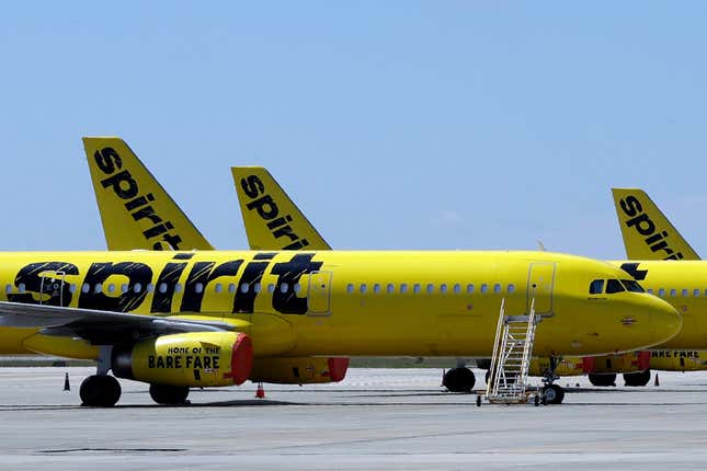 FLE - A line of Spirit Airlines jets sit on the tarmac at the Orlando International Airport on May 20, 2020, in Orlando, Fla. A federal judge is siding with the Biden administration and blocking JetBlue Airways from buying Spirit Airlines, saying the $3.8 billion deal would reduce competition. The Justice Department sued to block the merger, saying it would drive up fares by eliminating Spirit, the nation’s biggest low-cost airline. (AP Photo/Chris O&#39;Meara, File)