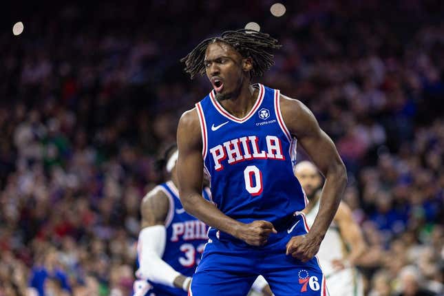 Nov 15, 2023; Philadelphia, Pennsylvania, USA; Philadelphia 76ers guard Tyrese Maxey (0) reacts after his score and one against the Boston Celtics during the third quarter at Wells Fargo Center.