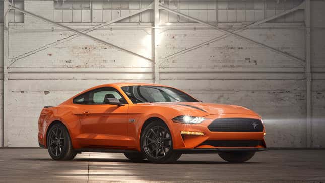 A photo of an orange Ford Mustang muscle car. 