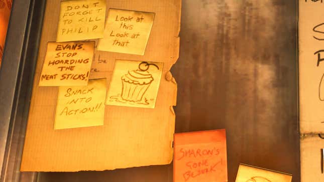 Small notes on a wall, a picture of a cupcake can also be seen. 