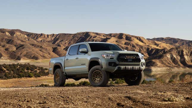 A green Toyota Tacoma pickup truck 