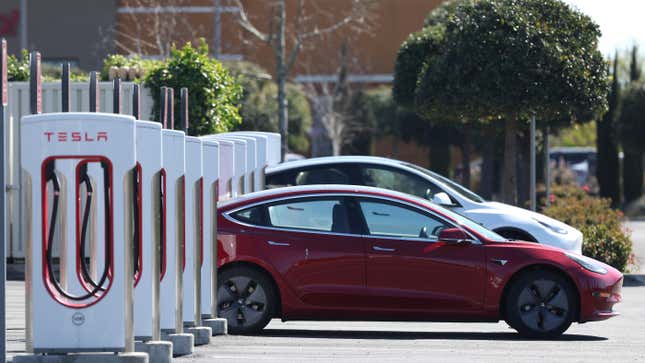 Teslas charging at a Supercharger