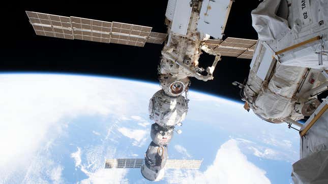 A photo of a capsule docking at the International Space Station. 