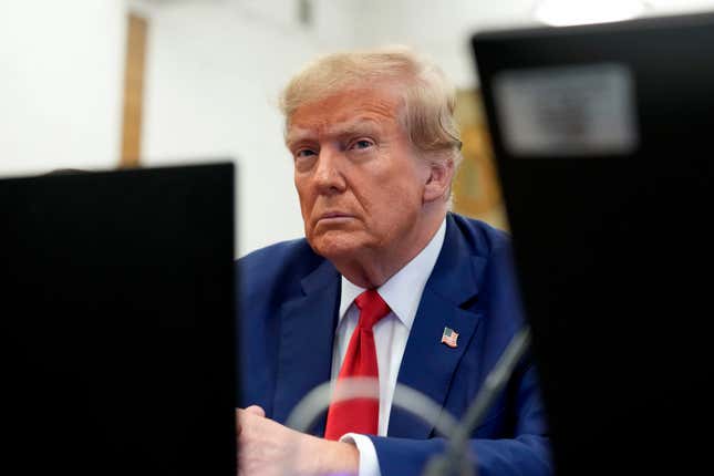 FILE - Former President Donald Trump sits in the courtroom before the start of closing arguments in his civil business fraud trial at New York Supreme Court, Jan. 11, 2024, in New York. Records show over the past two years, Axos Bank and its largest individual shareholder Don Hankey, have extended more than $500 million in financing that has benefited Trump. Ethics experts say they could also grant Hankey and Axos Bank outsize sway in a future Trump administration. (AP Photo/Seth Wenig, Pool, File)