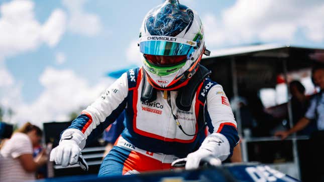 Simona de Silvestro climbs into her car at the 2022 Big Machine Music City Grand Prix in Nashville.