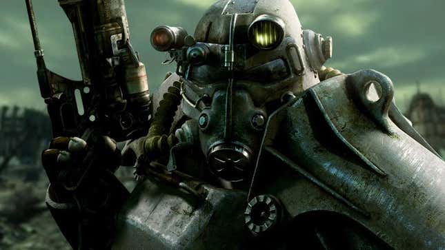 A person in power armor holds up a gun. 