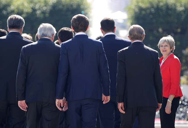 Theresa May arrives for a family photo during the informal EU summit in Salzburg, Austria.