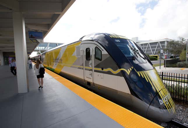 FILE - A Brightline train is shown at a station in Fort Lauderdale, Fla., on Jan. 11, 2018. A high-speed rail line between Las Vegas and the Los Angeles area is getting a Biden administration pledge of $3 billion to help start laying track. Nevada&#39;s two Democratic U.S. senators said Tuesday, Dec. 5, 2023 the $12 billion project led by Brightline West has all required right-of-way, environmental and labor approvals. (AP Photo/Wilfredo Lee, File)