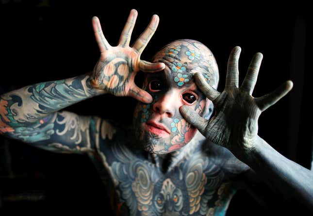 Sylvain, alias Freaky Hoody, a primary school teacher and France's most tattooed man, poses with his eyes full of black ink at Palaiseau, southern Paris, France.