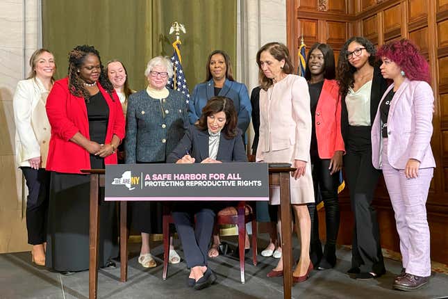 FILE - New York Gov. Kathy Hochul, center, signs bills expanding reproductive healthcare that will allow people in New York to receive contraceptives without a doctor&#39;s prescription, May 2, 2023, in Albany, N.Y. New Yorkers will be able to get contraceptives without a prescription under a standing order signed by state health officials on Tuesday, March 19, 2024. The move is part of Hochul&#39;s mission to bolster reproductive rights at a time when its restricted in other parts of the country. (AP Photo/Maysoon Khan, File)