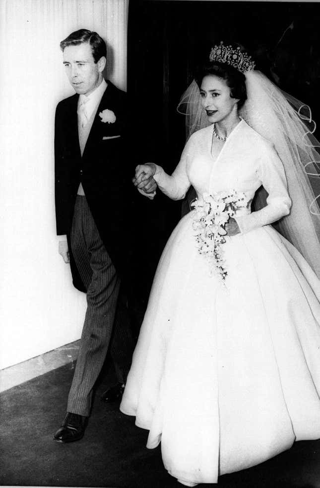 Anthony Armstrong-Jones holds the hand of his bride, Princess Margaret of Britain May 6, 1960 as they leave London's Westminster Abbey after theIr wedding. (AP Photo)