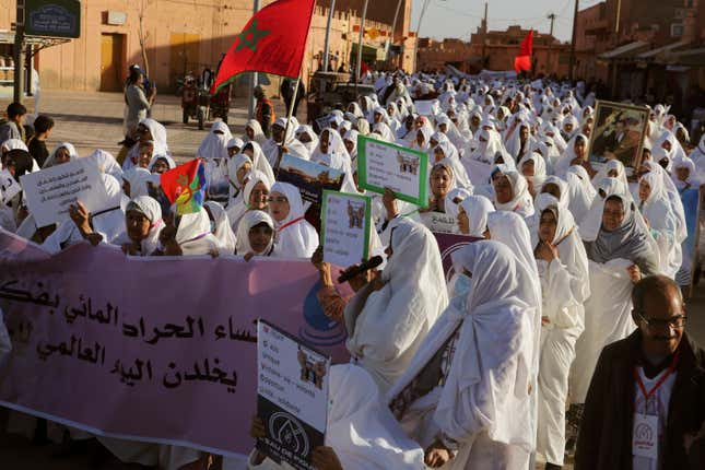 Women take part in a protest against a government plan to change the management of drinking water, in the oasis of Figuig, eastern Morocco, Friday, March 8, 2024. Banner in Arabic reads &quot;Figuig&#39;s Women commemorate World Water Day.&quot; Regional leaders in Morocco met Thursday, March 21, 2024 with residents of an oasis where many have staged protests over a water management plan. Thousands in the eastern Moroccan town of Figuig have demonstrated against their municipal council’s plan to to transition drinking water management to a regional multi-service agency. (AP Photo)