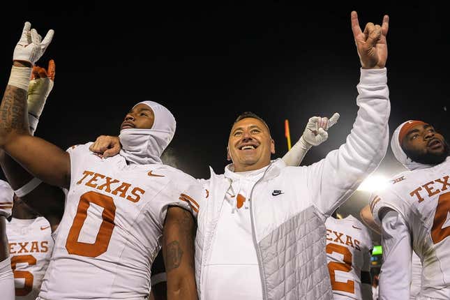 Nov 18, 2023; Ames, Iowa, USA; Texas Longhorns head coach Steve Sarkisian and linebacker Anthony Hill Jr. (0) hold up the sign of the horns after their win over the Iowa State Cyclones at Jack Trice Stadium.