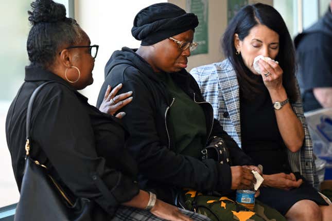 BRIGHTON, CO - OCTOBER 10: Sheneen McClain, Elijah McClains mother, center, is comforted by Tonya Chapman, left, as she gets emotional in the hallway during a break in closing arguments at the Adams County Justice Center on October 10, 2023 in Brighton, Colorado. Closing arguments are taking place in the trial of two Aurora police officers, Jason Rosenblatt and Randy Roedema, who are being charged in the death of Elijah McClain. The officers are both charged with criminally negligent homicide, manslaughter and assault. 