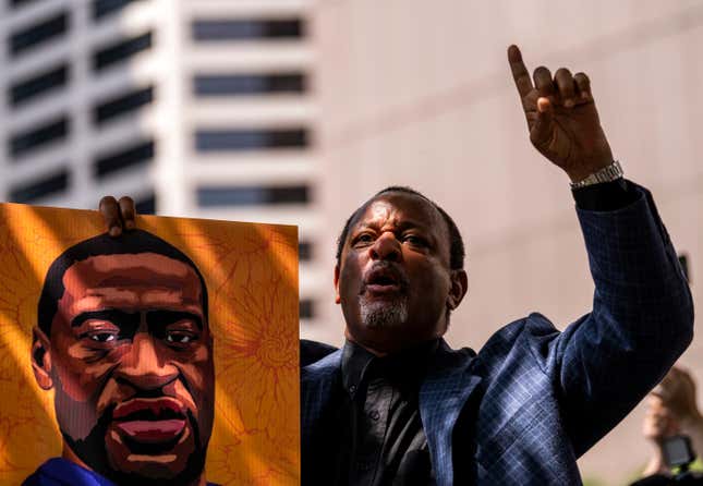 MINNEAPOLIS, MN - JUNE 25: Najee Ali chants, “One down, three to go!” outside the Hennepin County Government Center after the sentencing of Derek Chauvin on June 25, 2021 in Minneapolis, Minnesota. The former Minneapolis Police officer was sentenced to 22.5 years in prison today after being convicted of murder in the death of George Floyd.