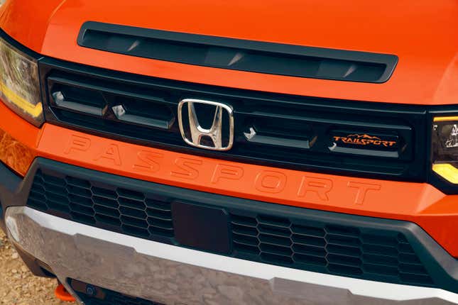 Front end detail of an orange 2026 Honda Passport TrailSport