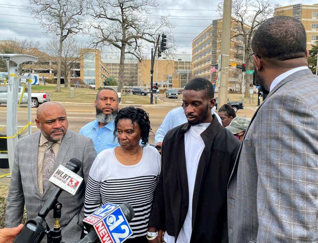 Michael Jenkins, second from right, stand with his mother, Mary Jenkins, center, and their attorneys at a news conference Wednesday, Feb. 15. 2023, in Jackson, Miss., following his release from the hospital three weeks after being shot by sheriff’s deputies.