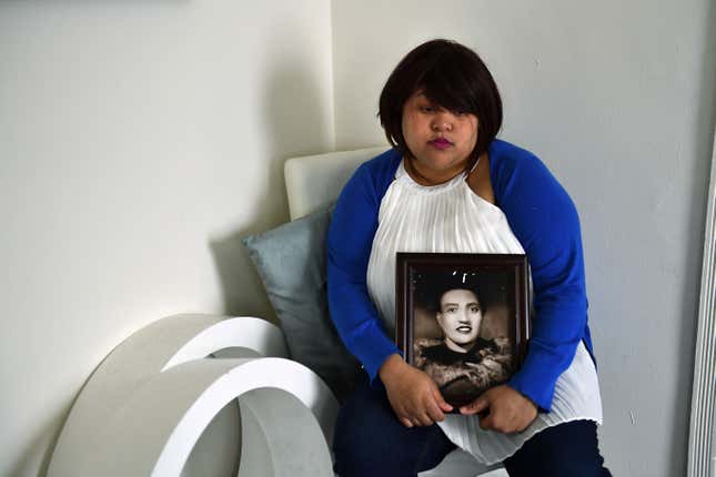 BALTIMORE, MD - MARCH 28: Veronica Spencer, great granddaughter of Henrietta Lacks, whose cancer cells are some of the most important in medical research, poses at her home with a portrait of her great grandmother March 28, 2017 in Baltimore, MD.