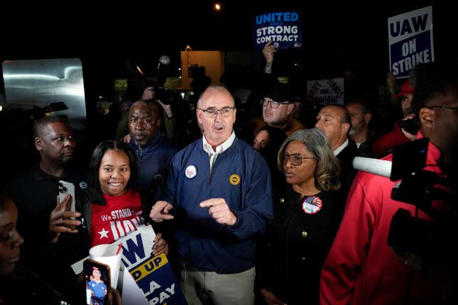 United Auto Workers President Shawn Fain speaks to union members striking at Ford&#39;s Michigan Assembly Plant in Wayne, Mich., early Friday, Sept. 15, 2023. (AP Photo/Paul Sancya)