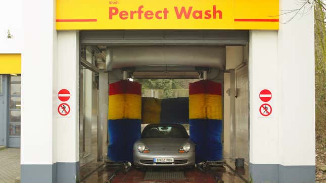 A photo of a car in an automatic car wash. 