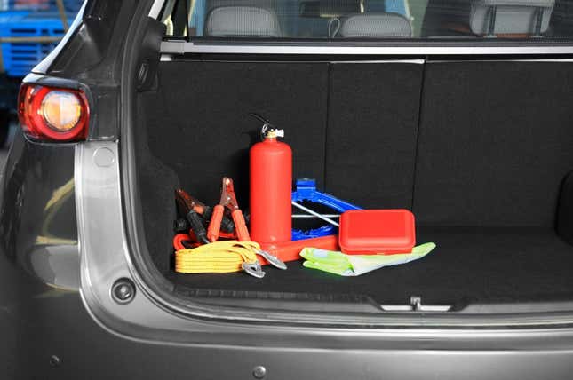 A roadside emergency kit in the trunk of a gray Mazda CX5