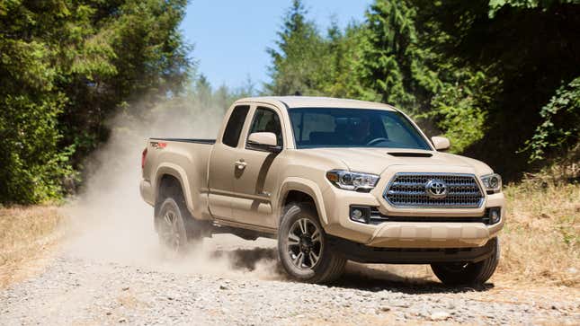 A beige-colored Toyota Tacoma truck. 