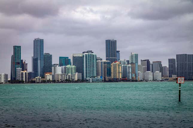 The Miami skyline is viewed from the Rickenbacker Causeway in South Florida, Dec. 15, 2023. South Carolina and Florida were the two fastest-growing states in the U.S., as the South region dominated population gains in 2023, and the U.S. growth rate ticked upward slightly from the depths of the pandemic due to a drop in deaths, according to estimates released Tuesday, Dec. 19 by the U.S. Census Bureau. (Pedro Portal/Miami Herald via AP)