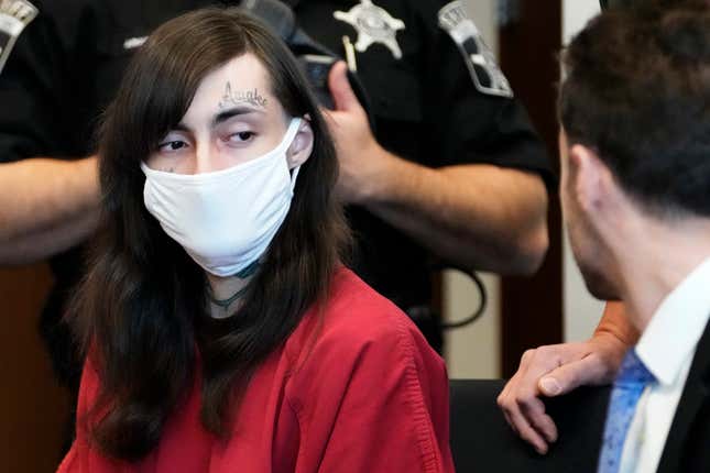 Robert E. Crimo III, left, looks at Assistant Public Defender at Lake County, Anton Trizna, right, during a hearing before Judge Victoria A. Rossetti at the Lake County Courthouse, Waukegan, Ill., Wednesday, Jan. 10, 2024. Crimo is charged in a mass shooting that left seven people dead during a July 4, 2022, parade in Highland Park, Ill. (AP Photo/Nam Y. Huh, Pool)