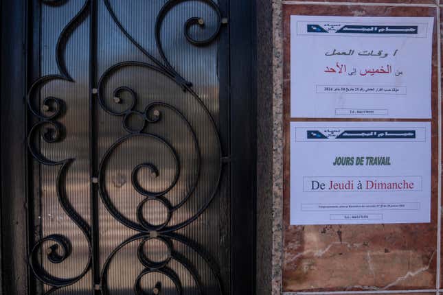 Notice posters are shown outside at a Moroccan traditional bath, known as hammam, while it is empty of customers, in Rabat, Morocco, Monday, March 4, 2024. Climate change and a yearslong drought have forced Morocco&#39;s famous public baths to close a few days a week in an effort to save water. The posters in Arabic read, &quot;Open from Thursday to Sunday, as per authorities decision.&quot; (AP Photo/Mosa&#39;ab Elshamy)