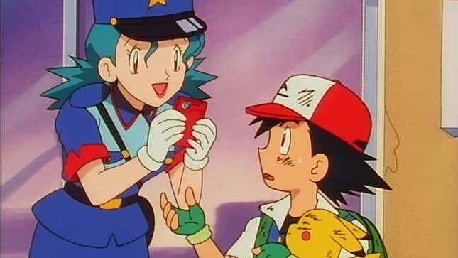 A Pokémon anime still shows Officer Jenny grab Ash Ketchum's pokédex.