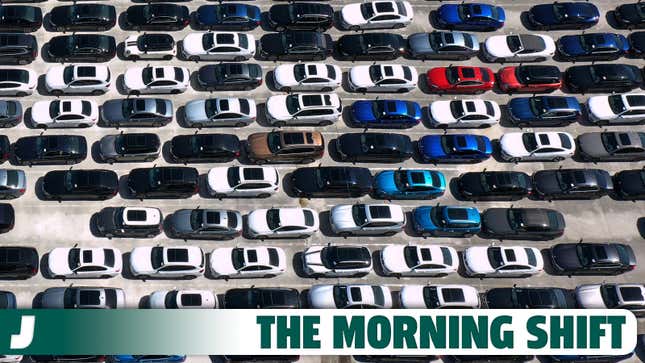 A photo of cars lined up for sale in a parking lot. 