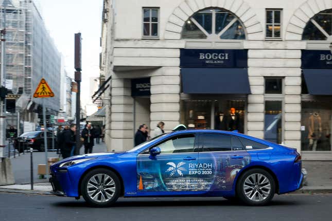 A taxi is decorated with a commercial for the Riyadh Expo 2030, Tuesday, Nov. 28, 2023 in Paris. In a high-profile showdown, Rome, Busan and Riyadh are the top contenders to become the host city of the 2030 World Expo, with the organizing body choosing the winner on Tuesday. (AP Photo/Thomas Padilla)