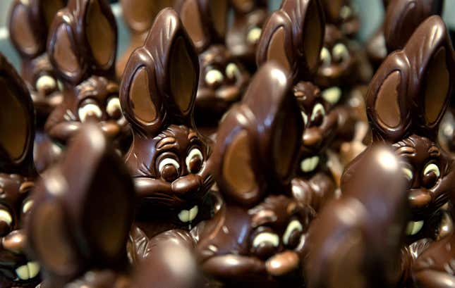 FILE - Chocolate rabbits wait to be decorated at the Cocoatree chocolate shop, April 8, 2020, in Lonzee, Belgium. Sweet Easter baskets will likely come at a bitter cost this year for consumers as the price of cocoa climbs to record highs. (AP Photo/Virginia Mayo, File)