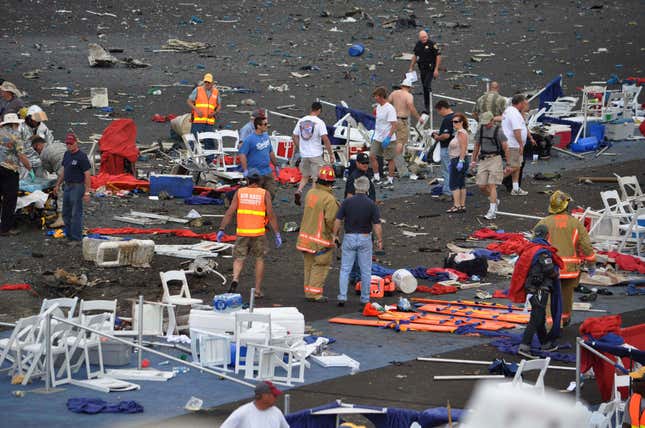 FILE - A crowd gathers around debris after a P-51 Mustang airplane crashed at the Reno Air show, Friday, Sept. 16, 2011, in Reno Nev., killing former Hollywood stunt pilot Jimmy Leeward and 10 people on the ground. It was one of the deadliest air show disasters in U.S. history. Another 70 people were seriously injured. (Tim O&#39;Brien/The Union via AP, File)