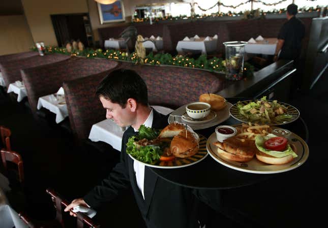 Waiter Alexander Alioto prepares to serve lunch to customers at Alioto’s Seafood Restaurant in San Francisco, California. 