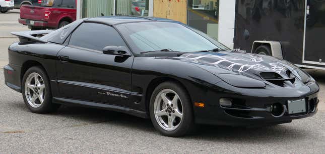 A black Firebird Trans Am parked 