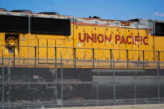 FILE - A Union Pacific train engine sits in a rail yard on Wednesday, Sept. 14, 2022, in Commerce, Calif. Union Pacific reports earnings on Thursday, April 20, 2023. The head of the union that represents track maintenance workers says Union Pacific is jeopardizing safety by delaying nearly 1,200 planned projects until next year and laying off more than 1,000 workers. (AP Photo/Ashley Landis, File)