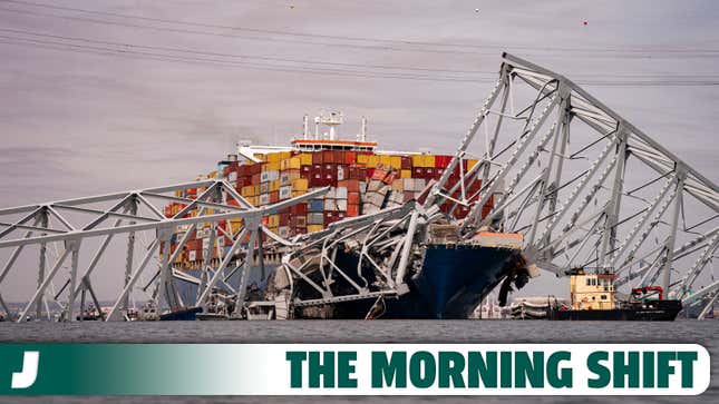 A photo of a container ship crashed into a steel bridge. 