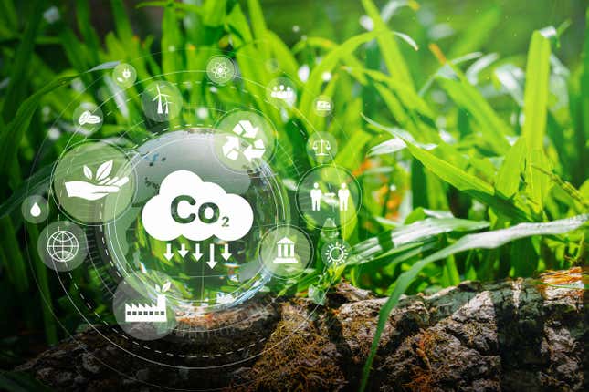 Illustration montrant des concepts de CO2 durables sur fond d’herbe