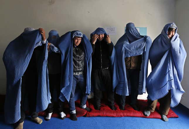 Image for article titled These awesome Afghan guys wore burqas for women’s rights