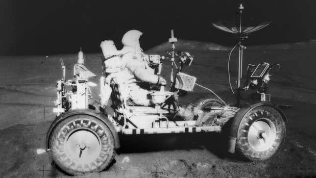 A black and white photo of a lunar rover. 