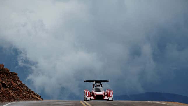  photo of a race car driving up Pikes Peak in Colorado.