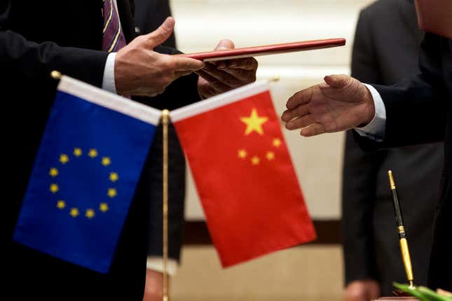 FILE - A member of European Commission, left, prepares to exchange documents with Chinese delegation at a signing ceremony after the 5th China-EU High Level Economic and Trade dialogue at Diaoyutai State Guest House in Beijing, on Sept. 28, 2015. The European Union&#39;s trade commissioner called for a more balanced economic relationship with China on Monday, Sept. 25, 2023, noting a trade imbalance of nearly 400 billion euros ($425 billion), while also warning that China&#39;s position on the war in Ukraine could endanger its relationship with Europe. (AP Photo/Andy Wong, File)