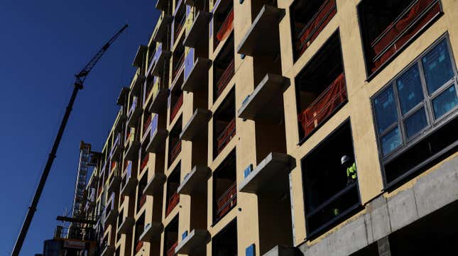 A construction worker labors inside a condominium site along the beach in Long Beach, New York, U.S., October 7, 2022.