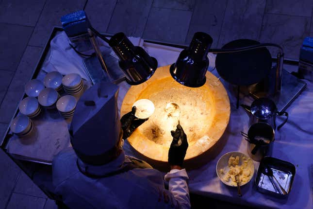 A chef prepares dishes of risotto at the WEF in Davos, Switzerland, on Tuesday, Jan. 21, 2025.