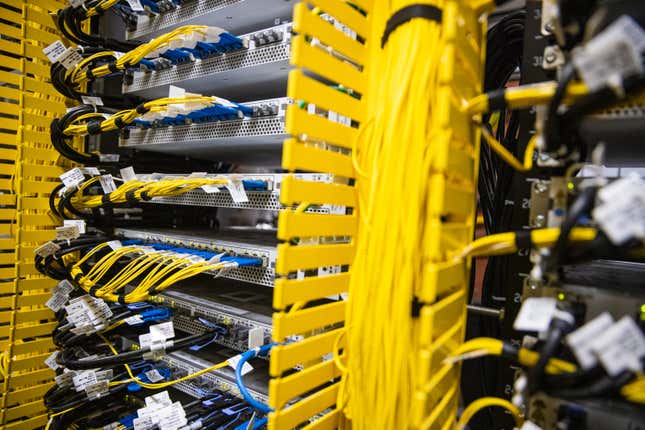 close up of servers with yellow and blue wires