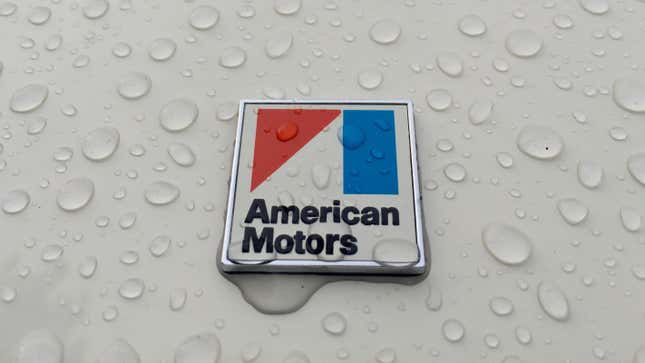 Detail of corporate logo below the rear window on a 1970 AMC Javelin SST in white with 304 V8 and automatic