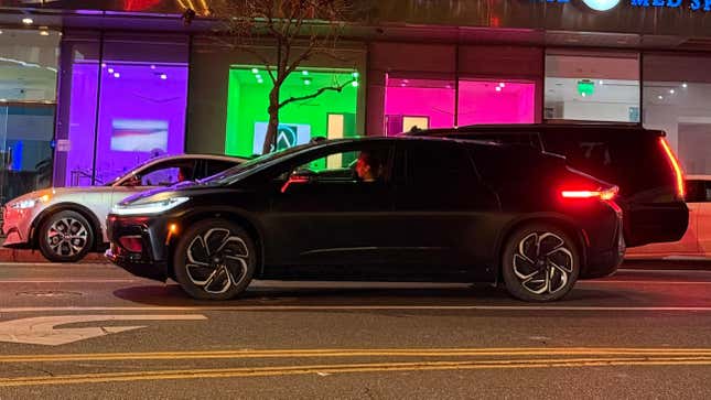 Side view of a black Faraday Future FF91