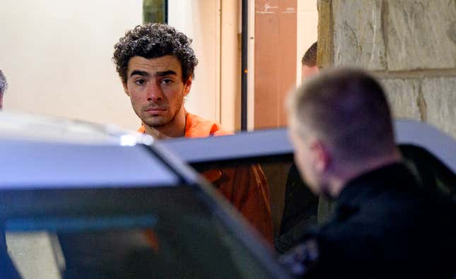 Suspected shooter Luigi Mangione is led from the Blair County Courthouse after an extradition hearing December 10, 2024 in Hollidaysburg, Pennsylvania. Mangione has been arraigned on weapons and false identification charges related to the fatal shooting of United Healthcare CEO Brian Thompson in New York City. Mangione is incarcerated in the State Correctional Institution in Huntingdon, Pennsylvania awaiting extradition to New York