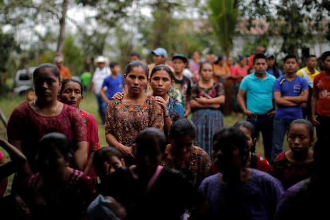 Local residents attend the funeral of Jakelin Caal at her home village of San Antonio Secortez, in Guatemala.